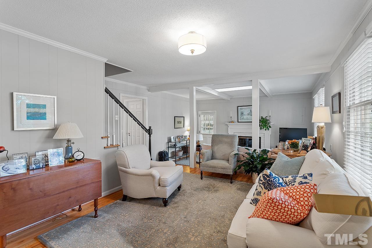 2408 Wentworth Street Raleigh, NC 27612 - Photo 10 of 33 a living room with furniture and a potted plant