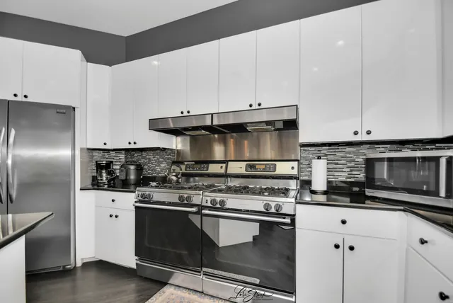a view of a large window with wooden floor and outdoor view