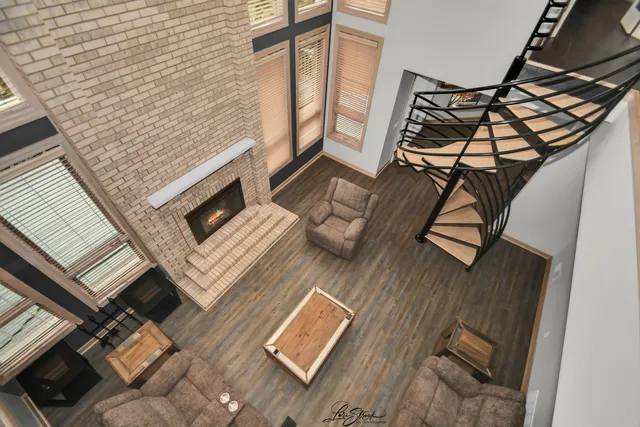 a view of a workspace with furniture and wooden floor