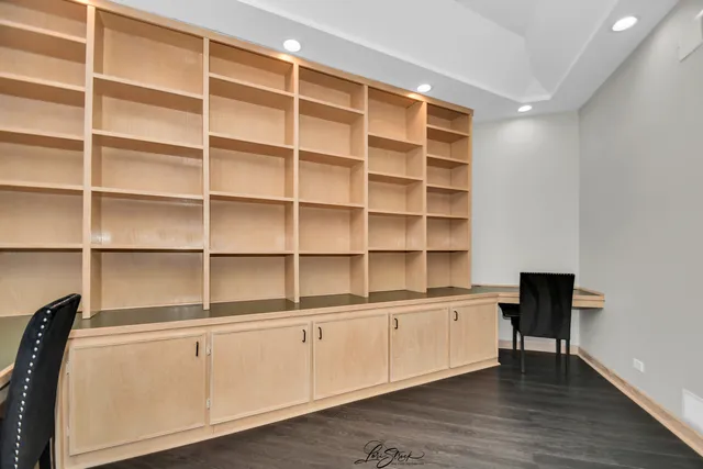 a view of a hall with wooden floor