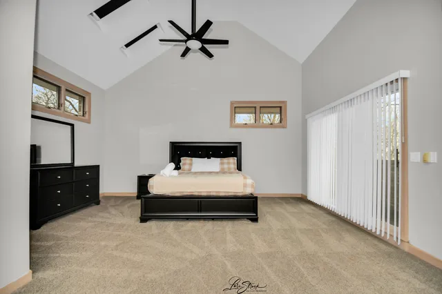 a spacious bathroom with a double vanity sink and a large mirror