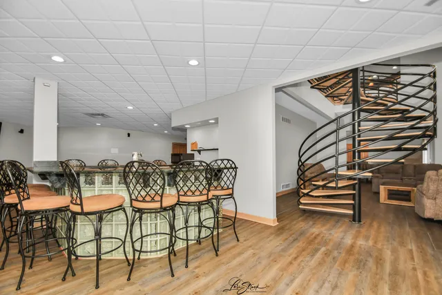 a big house with large windows and a yard