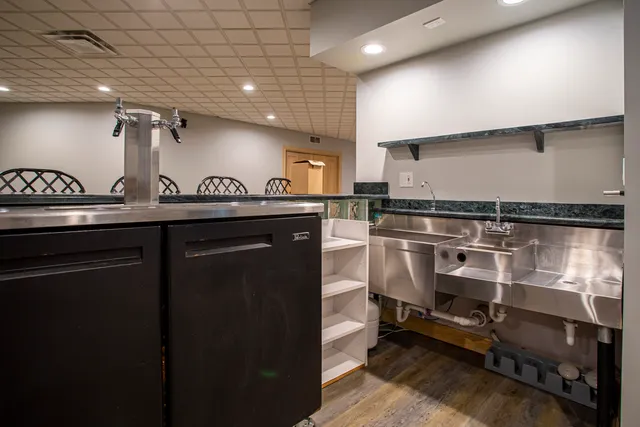 a view of backyard with a garden and deck