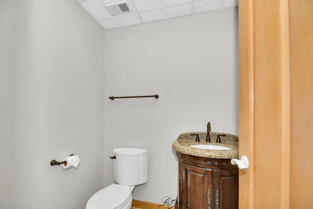 a view of a chairs and tables in the balcony