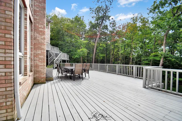 a view of a field with trees in the background