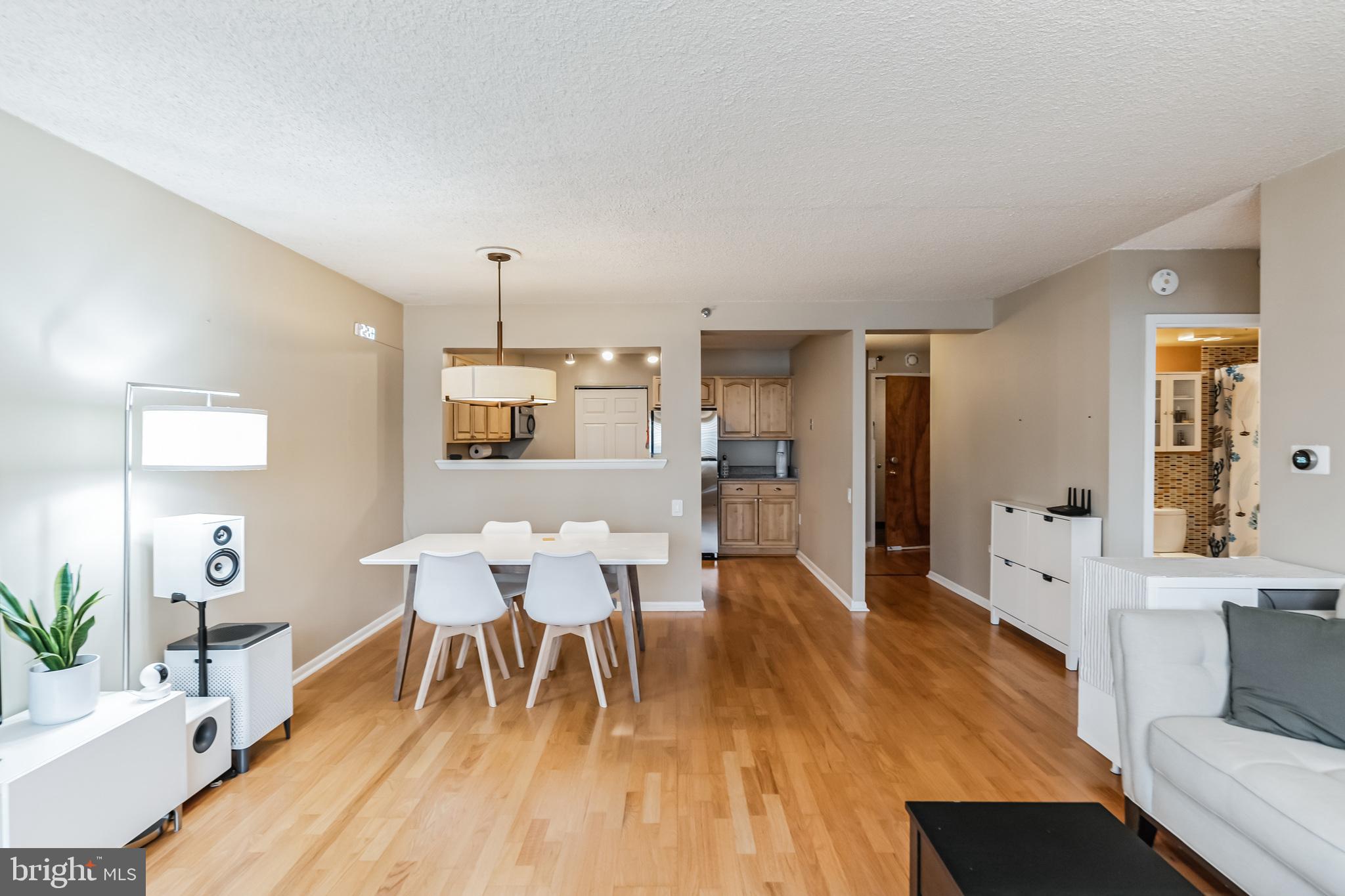 2201 Cherry Street, Unit 603 Philadelphia, PA 19103 - Photo 11 of 32 a view of a dining room with furniture and wooden floor