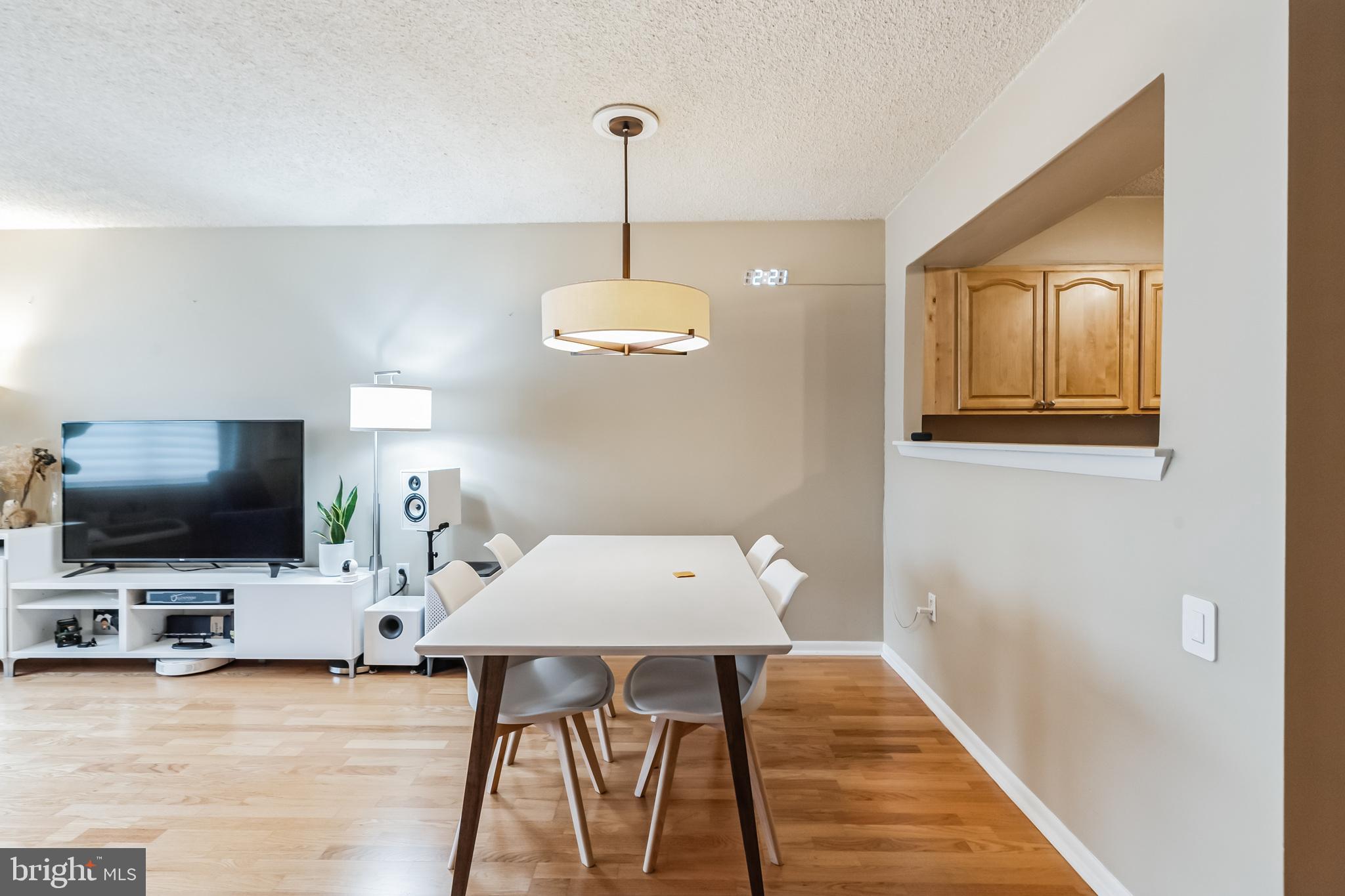 2201 Cherry Street, Unit 603 Philadelphia, PA 19103 - Photo 16 of 32 a view of a livingroom with furniture and a flat screen tv