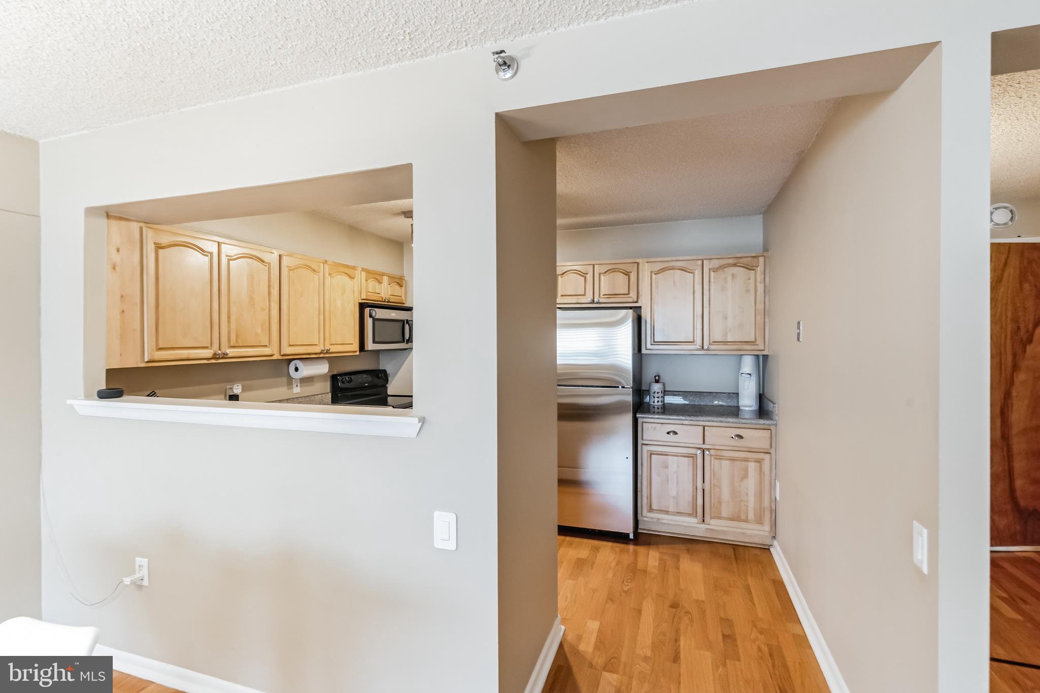 2201 Cherry Street, Unit 603 Philadelphia, PA 19103 - Photo 17 of 32 a view of a kitchen from the hallway