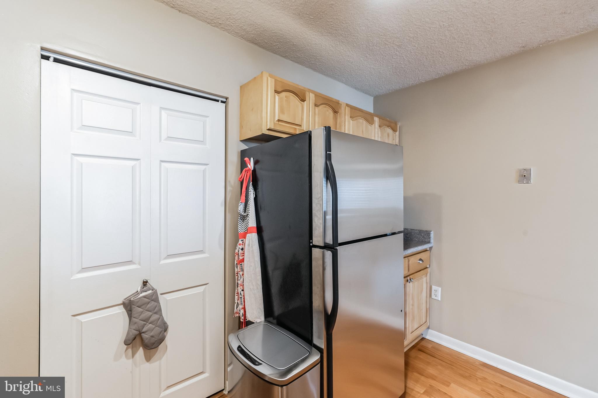 2201 Cherry Street, Unit 603 Philadelphia, PA 19103 - Photo 19 of 32 a bathroom with a refrigerator and a sink