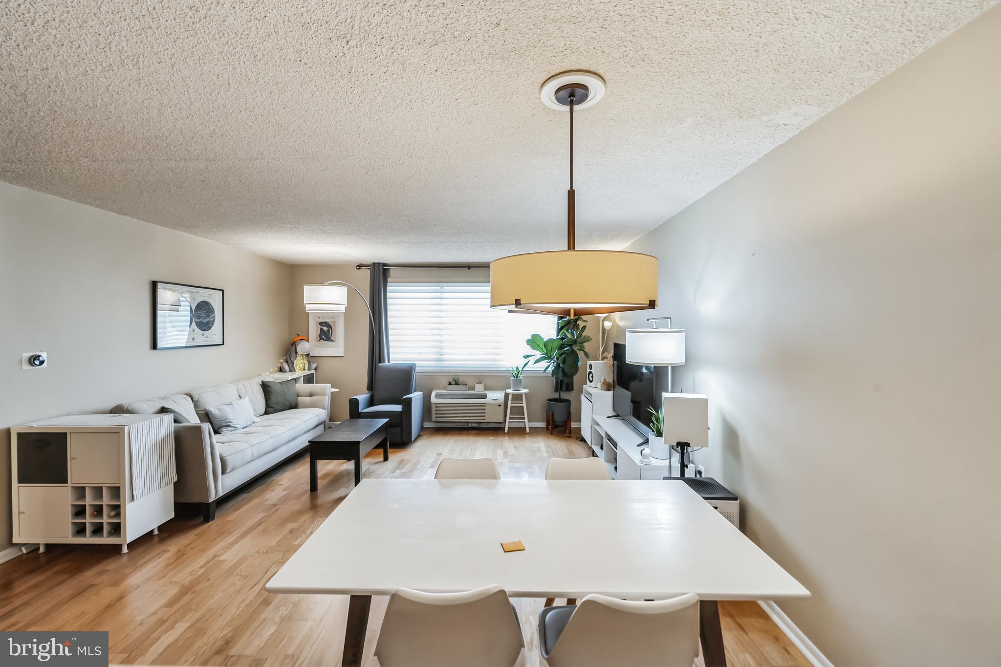 2201 Cherry Street, Unit 603 Philadelphia, PA 19103 - Photo 22 of 32 a living room with furniture and a wooden floor