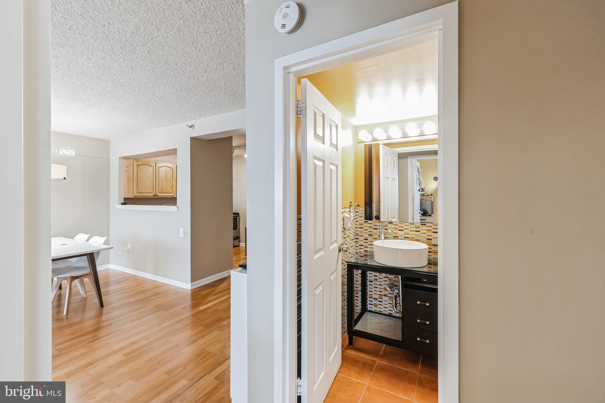 2201 Cherry Street, Unit 603 Philadelphia, PA 19103 - Photo 24 of 32 a view of a bathroom from a hallway