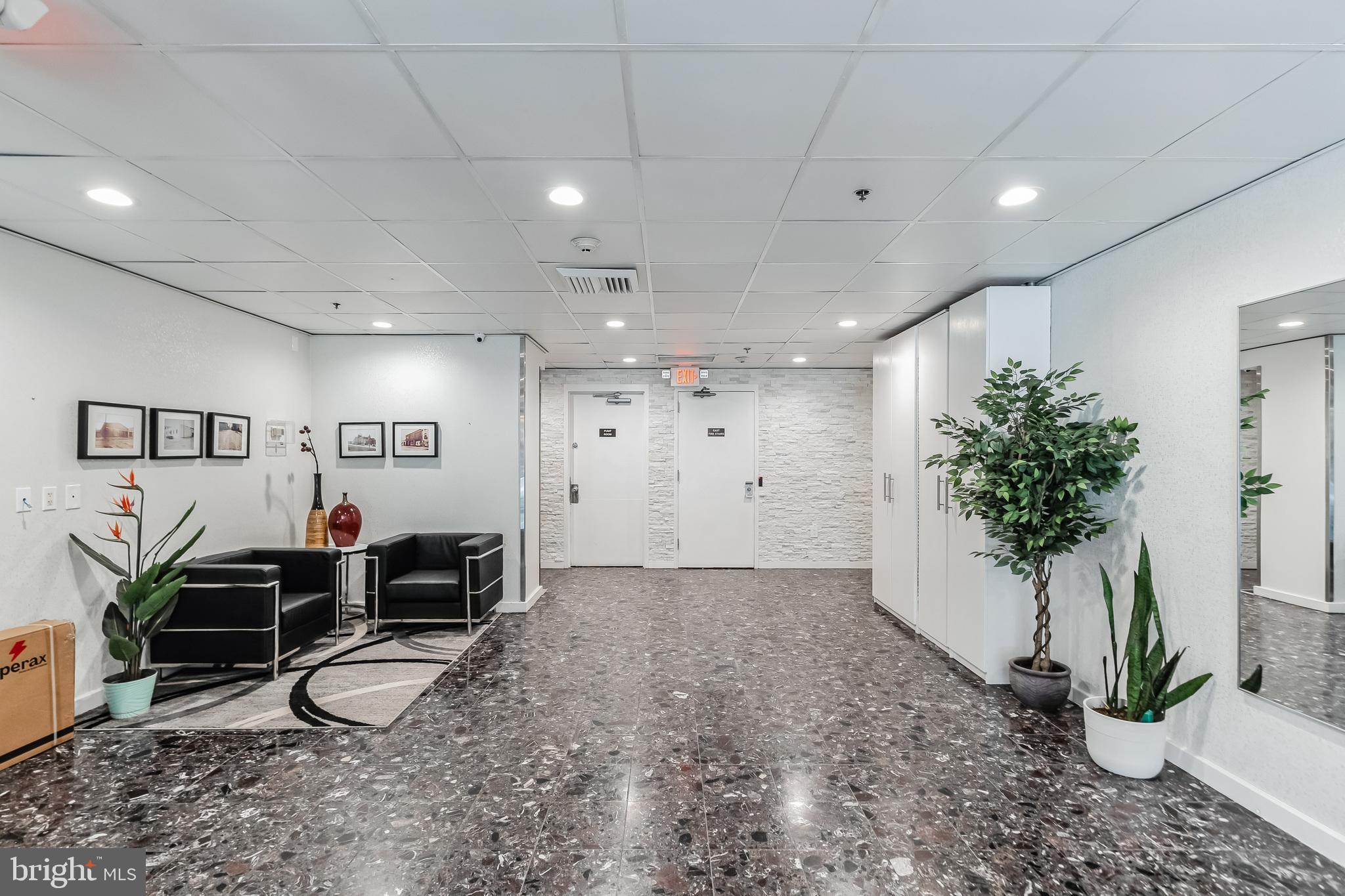 2201 Cherry Street, Unit 603 Philadelphia, PA 19103 - Photo 3 of 32 a view of a livingroom with furniture and a potted plant