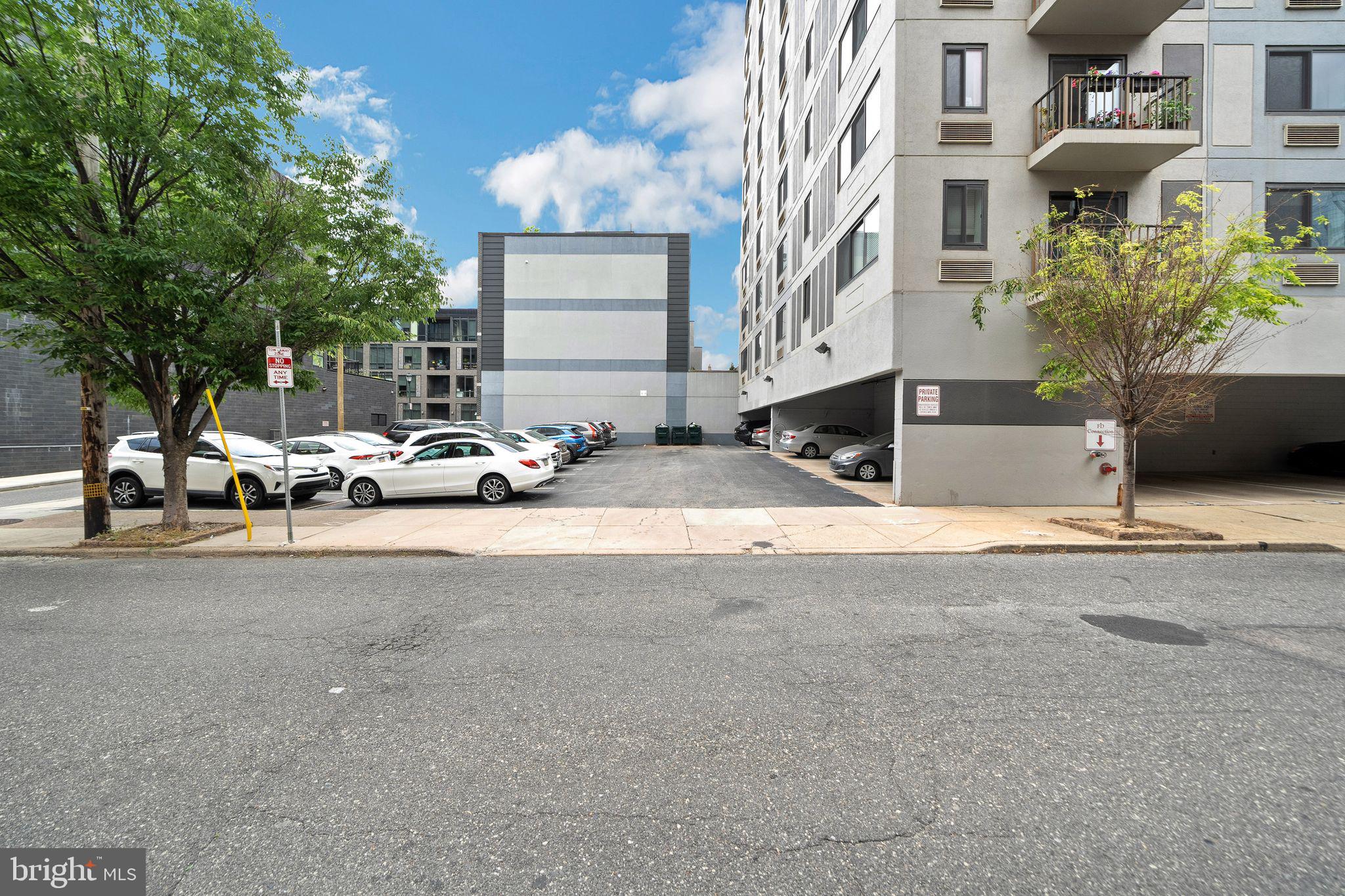 2201 Cherry Street, Unit 603 Philadelphia, PA 19103 - Photo 32 of 32 a group of cars parked in front of a building