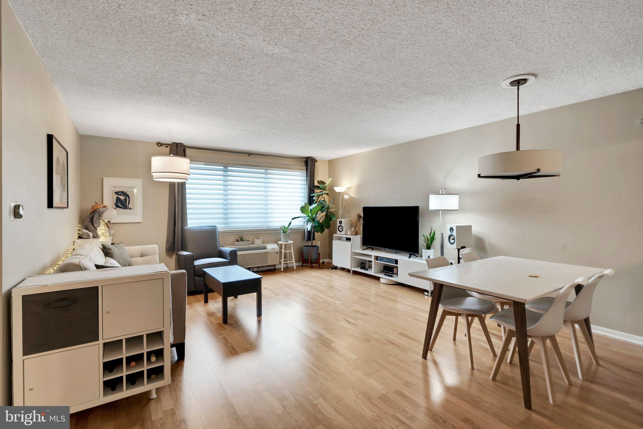 2201 Cherry Street, Unit 603 Philadelphia, PA 19103 - Photo 9 of 32 a workspace with furniture window and wooden floor