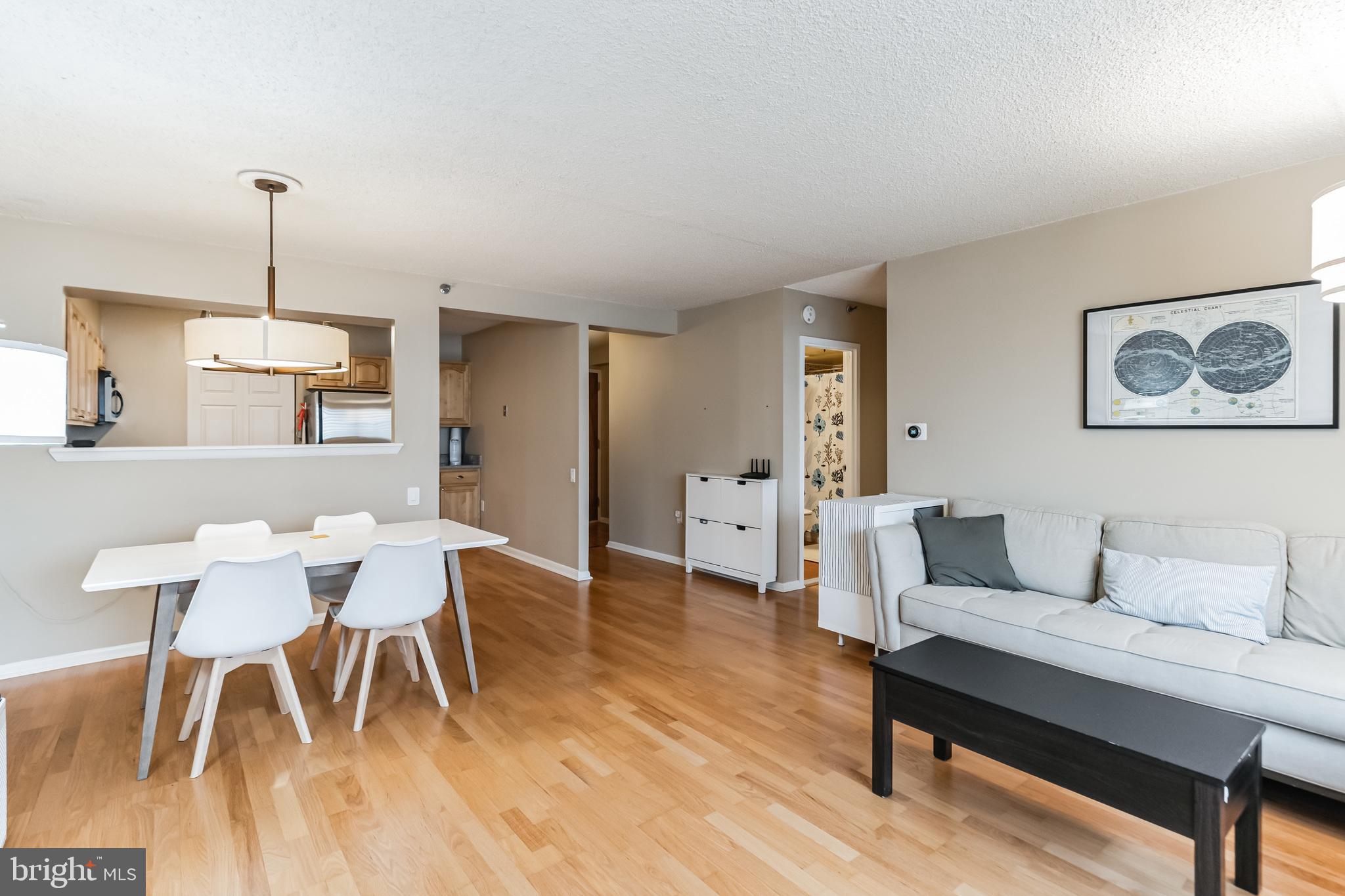 2201 Cherry Street, Unit 603 Philadelphia, PA 19103 - Photo 10 of 32 a living room with furniture and wooden floor