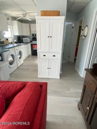a kitchen with a refrigerator a stove top oven and a sink