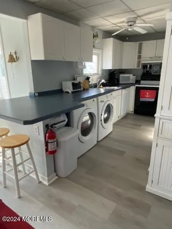 a kitchen with stainless steel appliances granite countertop a sink and a stove