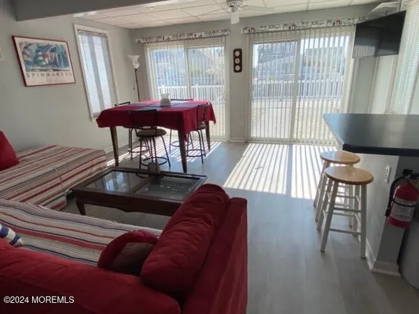 a living room with furniture and a gate