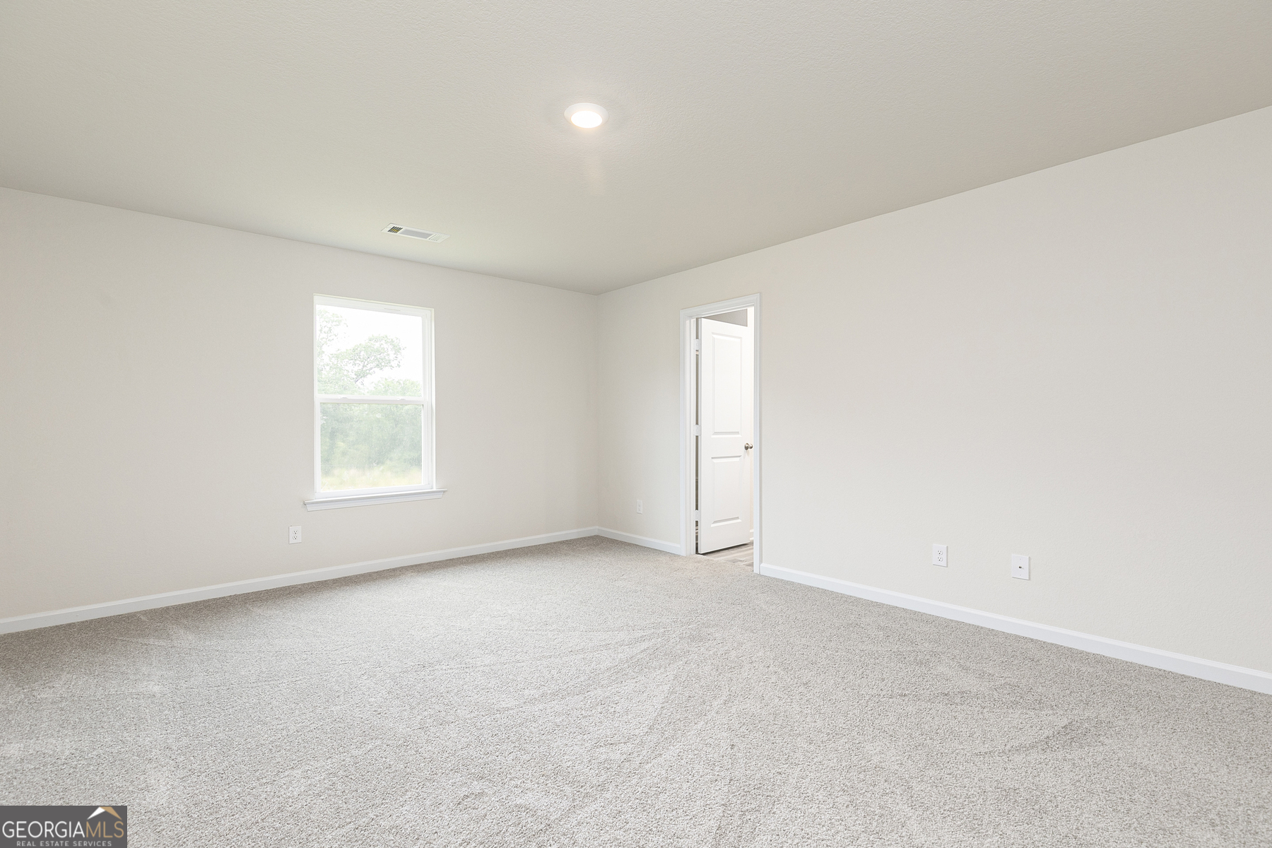 620 Slate Road Conyers, GA 30013 - Photo 13 of 22 an empty room with windows