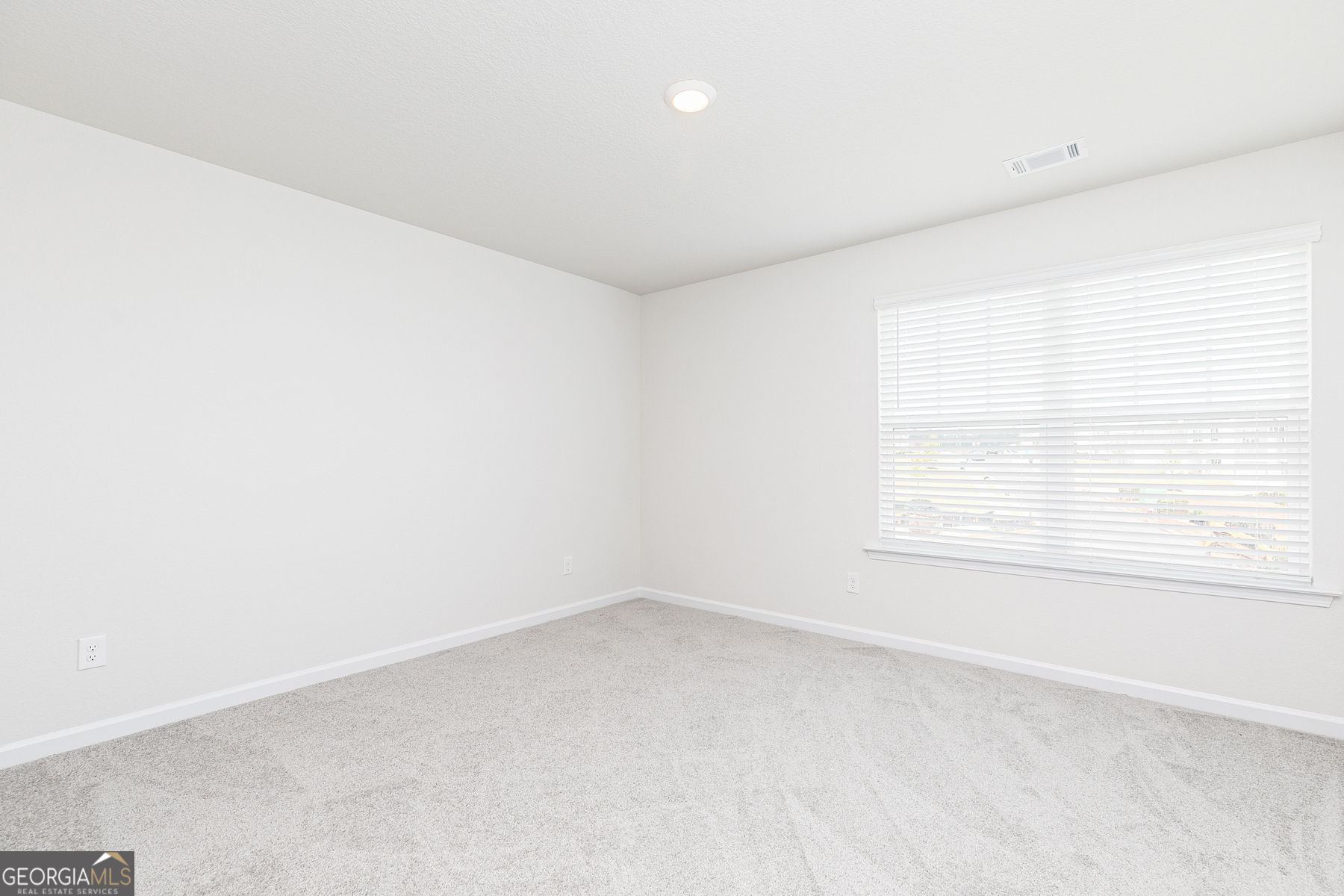 620 Slate Road Conyers, GA 30013 - Photo 20 of 22 an empty room with a window