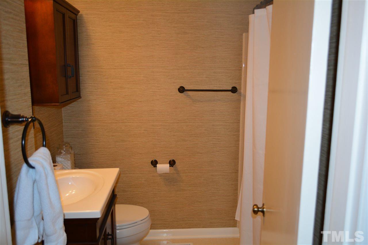 2604 Patrick Road Raleigh, NC 27604 - Photo 5 of 9 a bathroom with a sink and a mirror