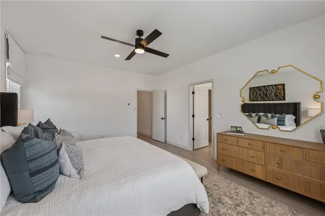 a large kitchen with kitchen island a sink a counter top space and stainless steel appliances