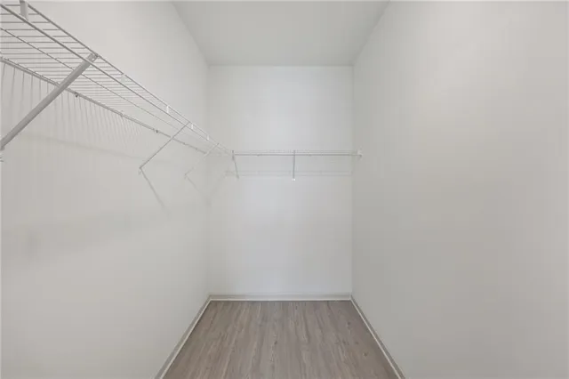 a room with gym equipment and a large window