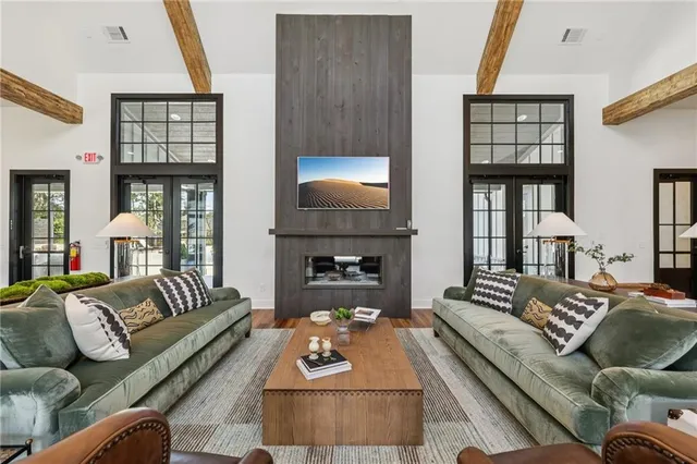 a view of a patio with a dining table and chairs