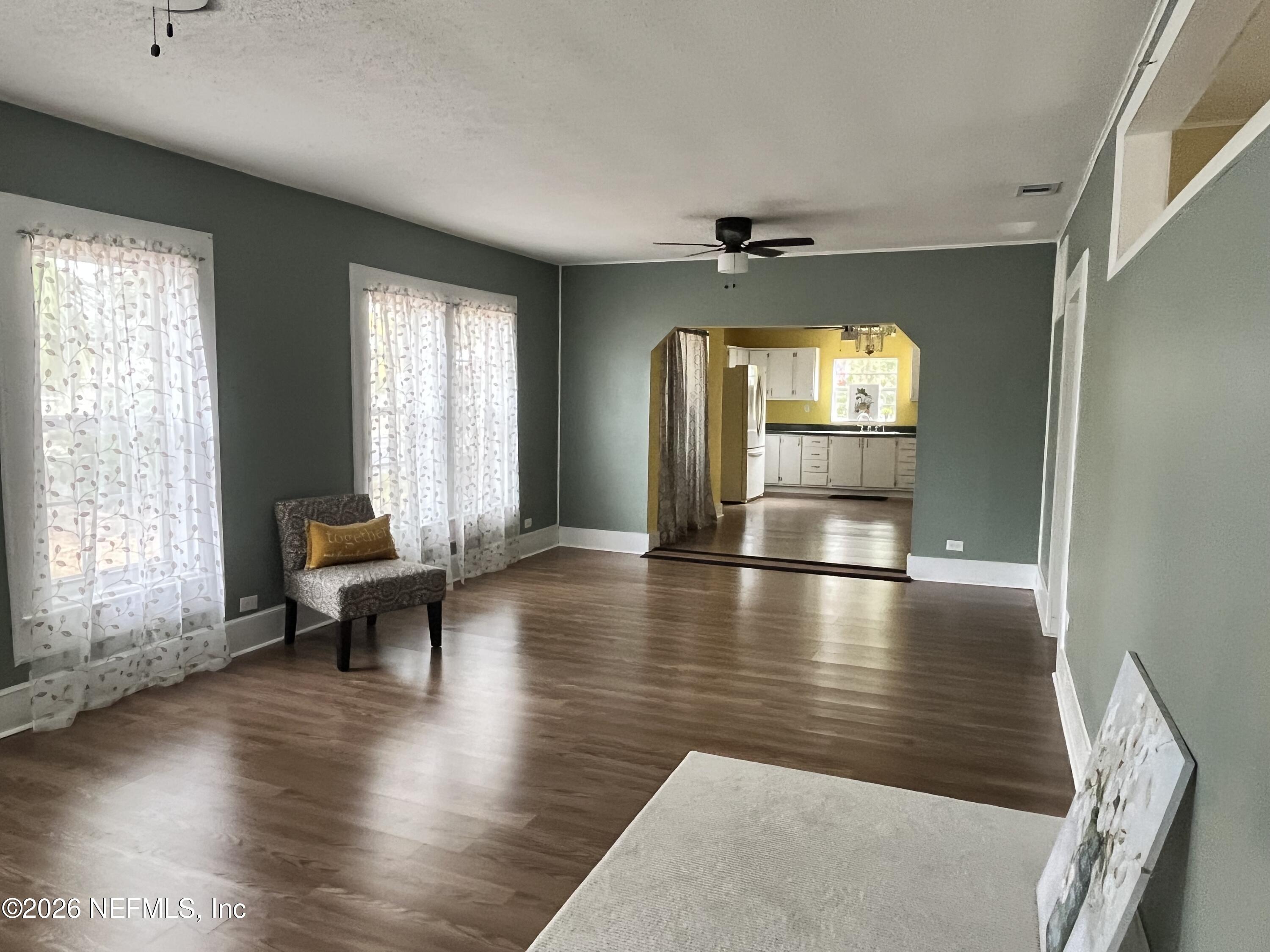 624 North Lake Street Starke, FL 32091 - Photo 11 of 34 a view of dining room with hardwood floor and a window