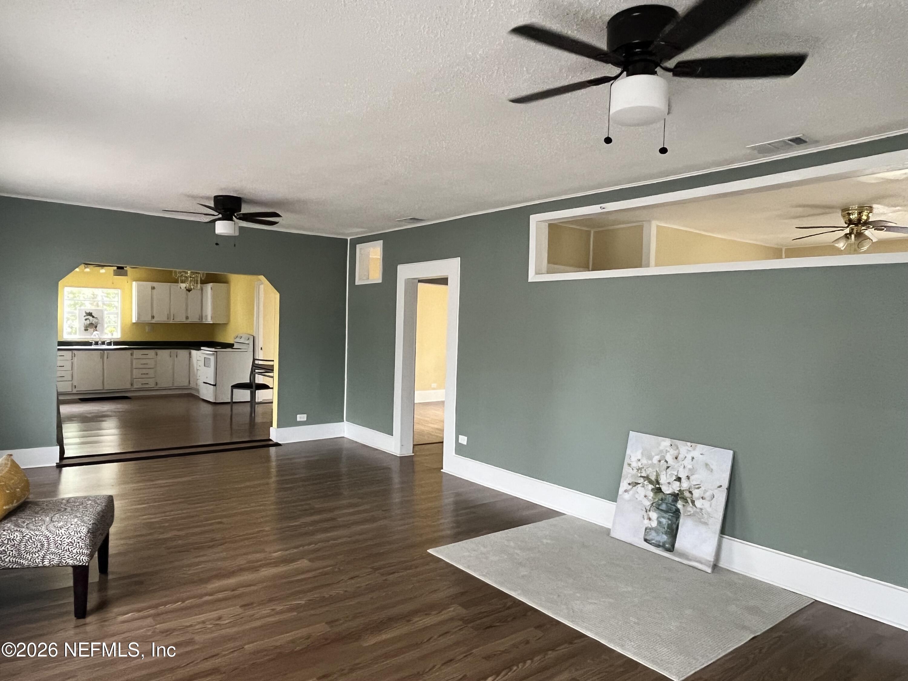 624 North Lake Street Starke, FL 32091 - Photo 13 of 34 a view of kitchen with furniture and wooden floor