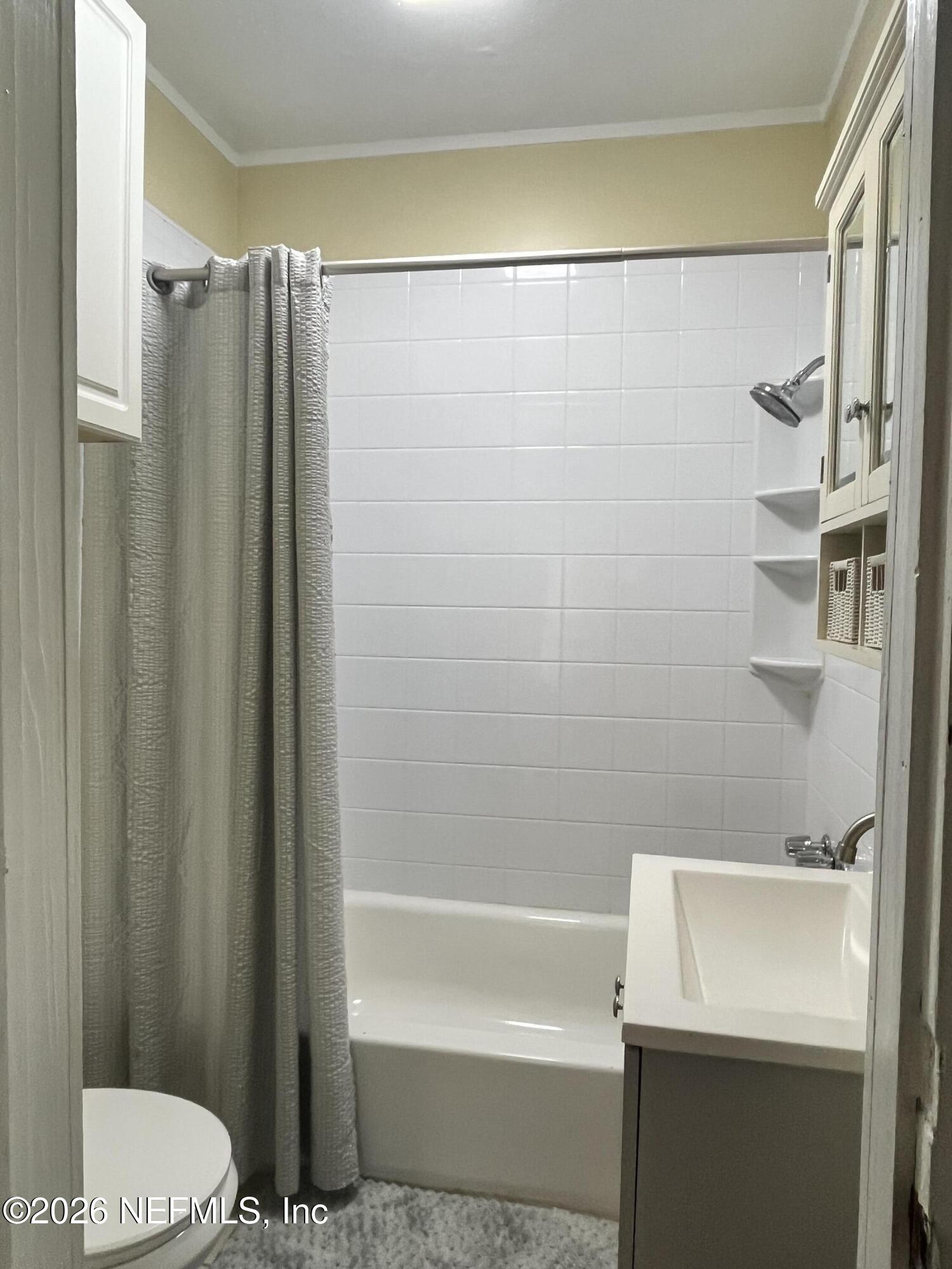 624 North Lake Street Starke, FL 32091 - Photo 34 of 34 a bathroom with a shower and a toilet