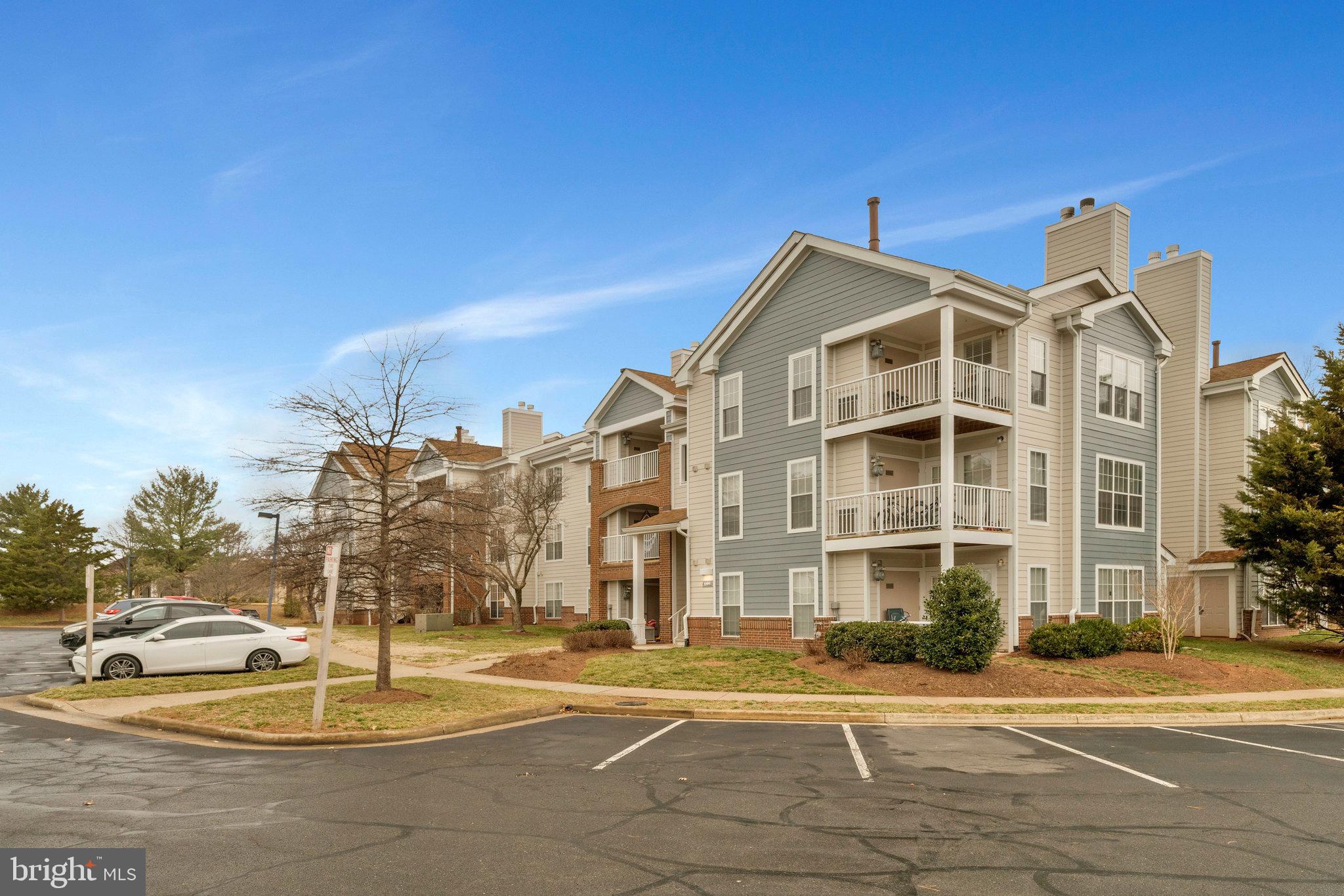 20991 Timber Ridge Terrace, Unit 103 Ashburn, VA 20147 - Photo 2 of 58 a front view of a building