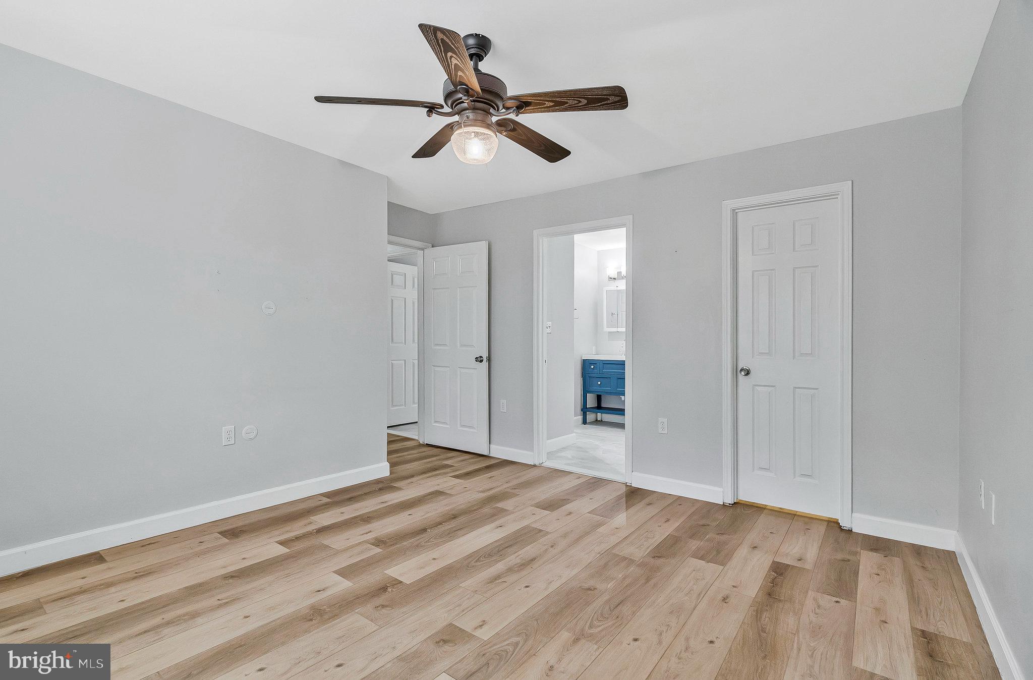 20991 Timber Ridge Terrace, Unit 103 Ashburn, VA 20147 - Photo 21 of 58 a view of a room with a wooden floor