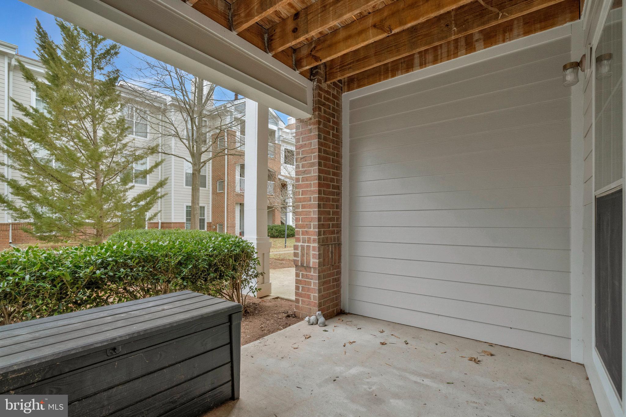 20991 Timber Ridge Terrace, Unit 103 Ashburn, VA 20147 - Photo 28 of 58 a outdoor space with porch
