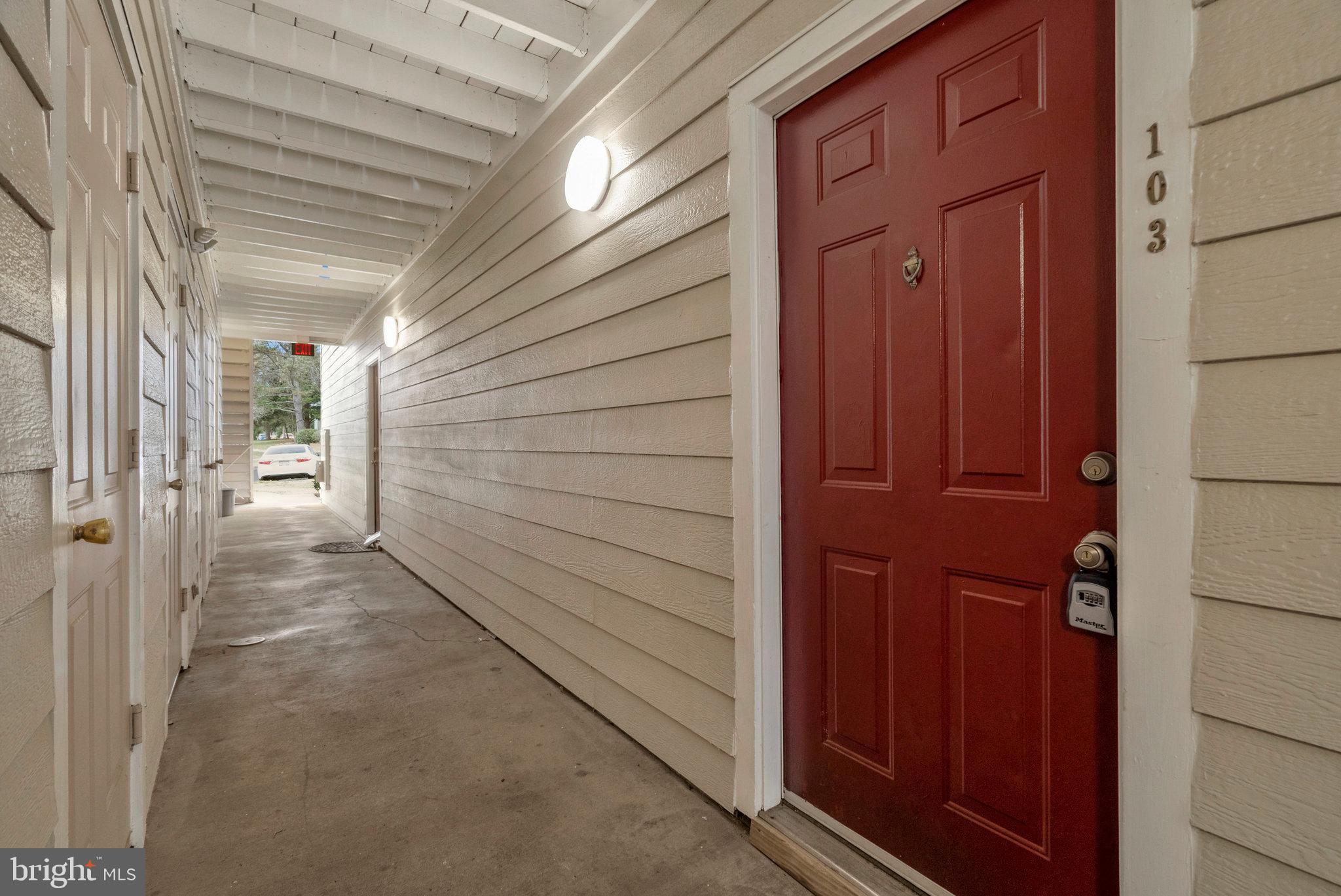 20991 Timber Ridge Terrace, Unit 103 Ashburn, VA 20147 - Photo 3 of 58 a view of a wooden door
