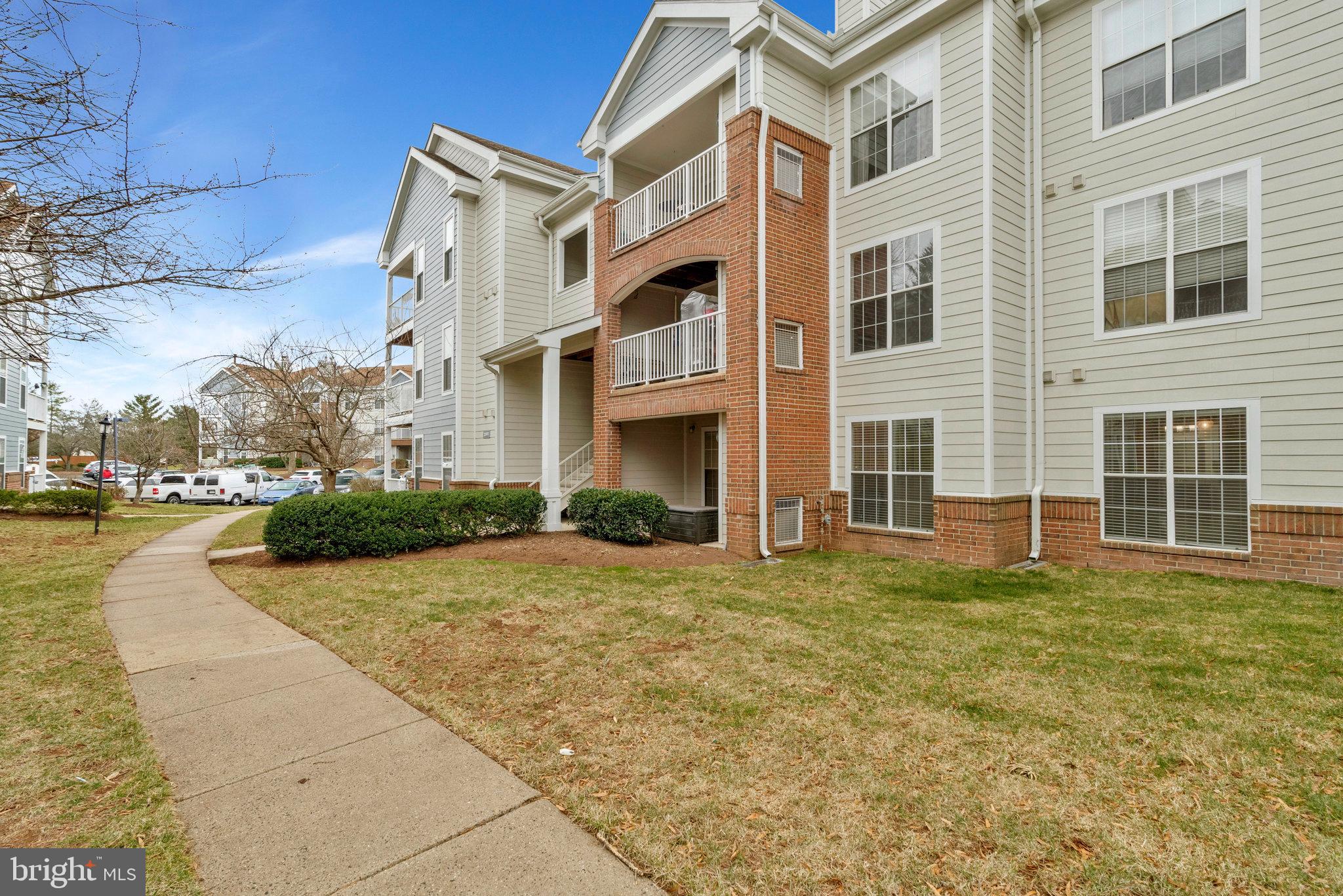 20991 Timber Ridge Terrace, Unit 103 Ashburn, VA 20147 - Photo 33 of 58 Walking from the parking lot