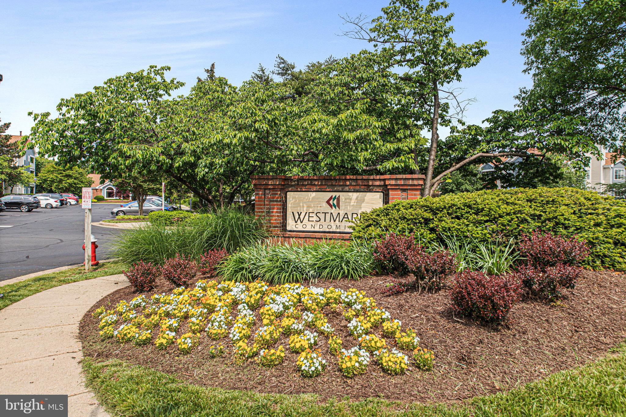 20991 Timber Ridge Terrace, Unit 103 Ashburn, VA 20147 - Photo 43 of 58 a view of a garden with an outdoor space