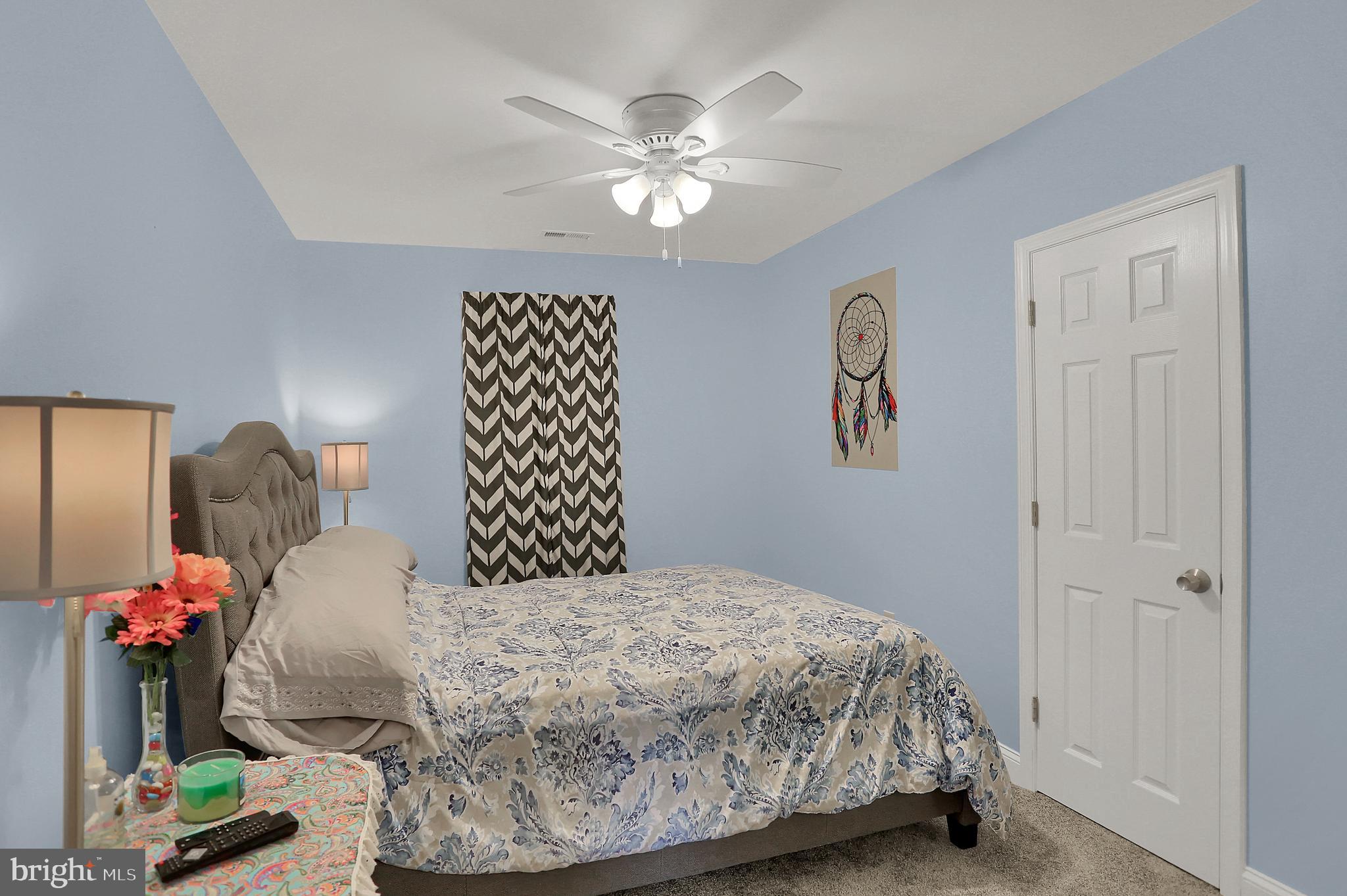 1901 Summit Avenue Rosedale, MD 21237 - Photo 12 of 26 a bedroom with a bed and a chandelier