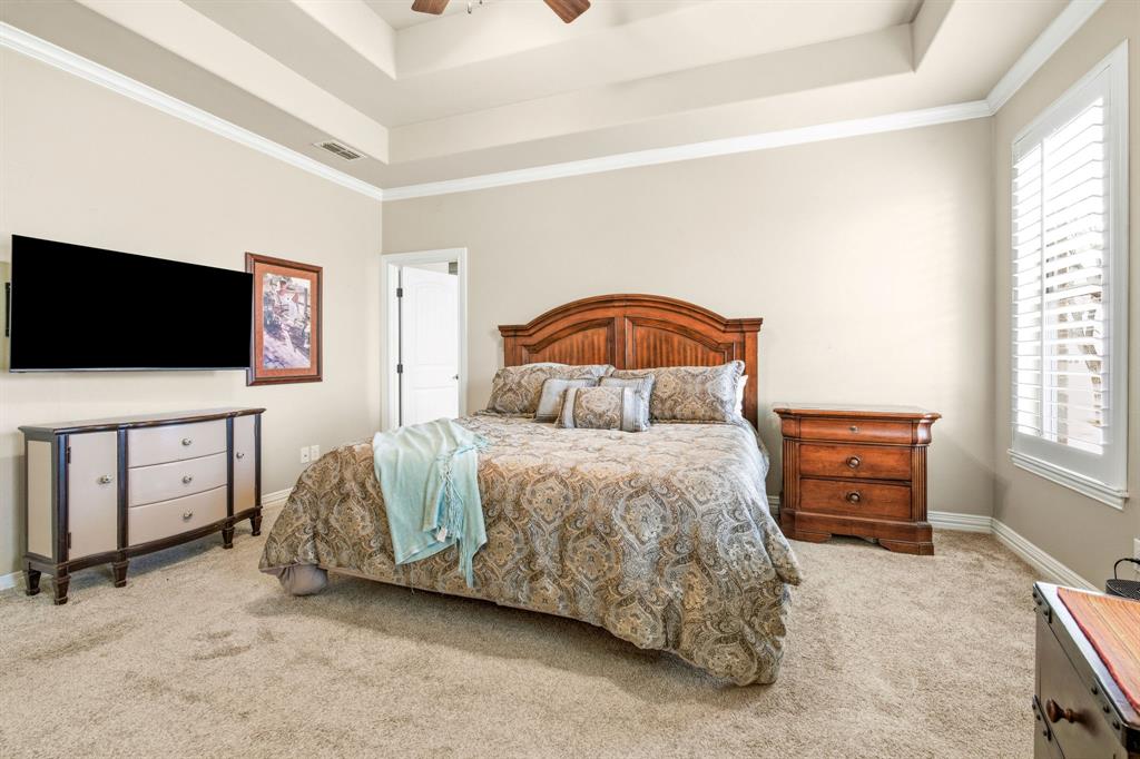 146 Mesquite Ridge Lane Lawn, TX 79530 - Photo 17 of 40 a bedroom with a bed and flat screen tv