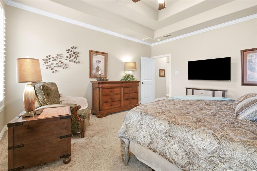 146 Mesquite Ridge Lane Lawn, TX 79530 - Photo 18 of 40 a bedroom with a bed and a flat screen tv
