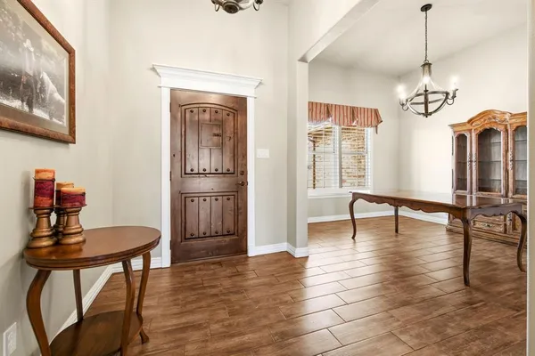 a view of a livingroom with furniture window and wooden floor