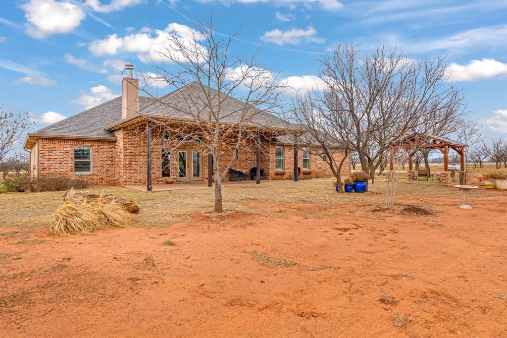 146 Mesquite Ridge Lane Lawn, TX 79530 - Photo 30 of 40 a view of white house with a yard