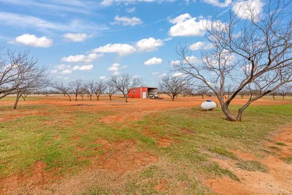 a view of white house with a yard