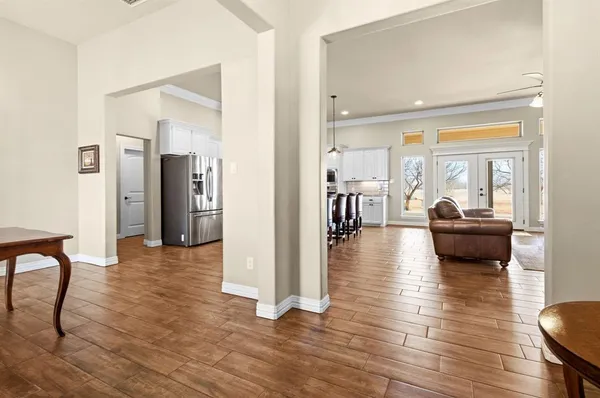 a view of a livingroom with furniture and hardwood floor