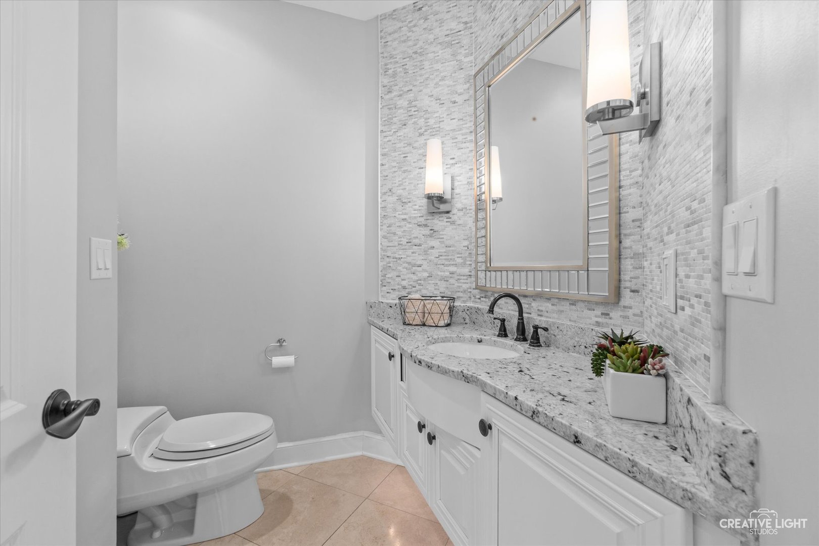 S147 North Mathewson Lane Geneva, IL 60134 - Photo 18 of 75 a bathroom with a granite countertop sink a toilet and a mirror