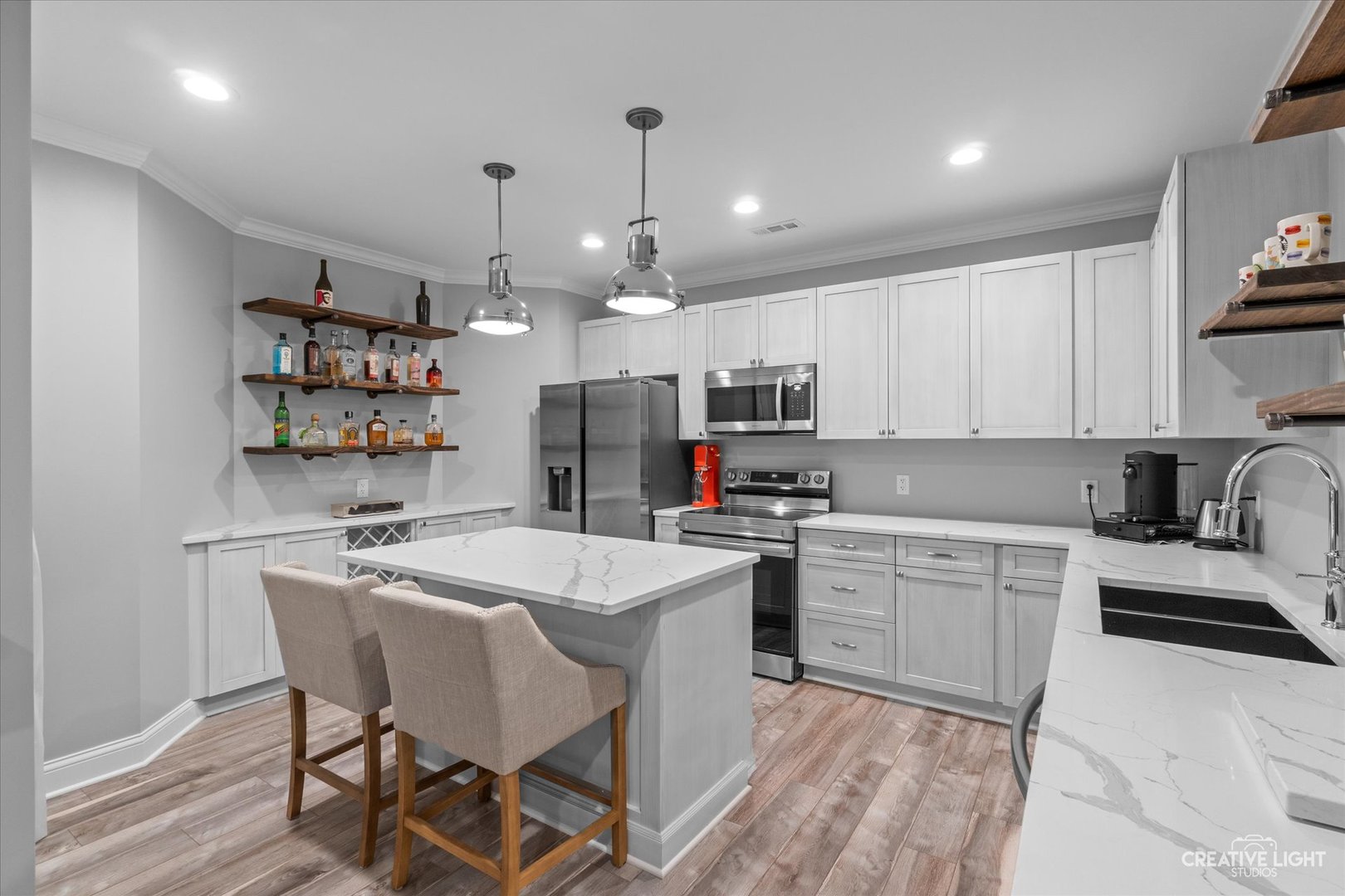 S147 North Mathewson Lane Geneva, IL 60134 - Photo 47 of 75 a kitchen with kitchen island a white counter top space a sink cabinets and appliances
