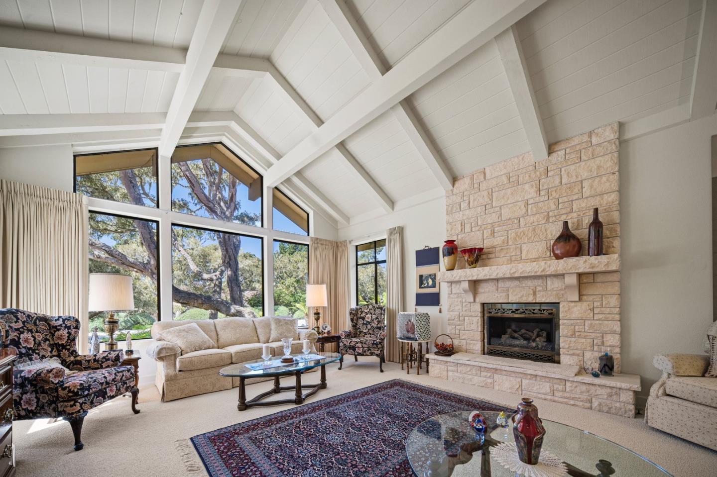 2911 Colton Road Pebble Beach, CA 93953 - Photo 7 of 46 a living room with furniture a large window and a fireplace