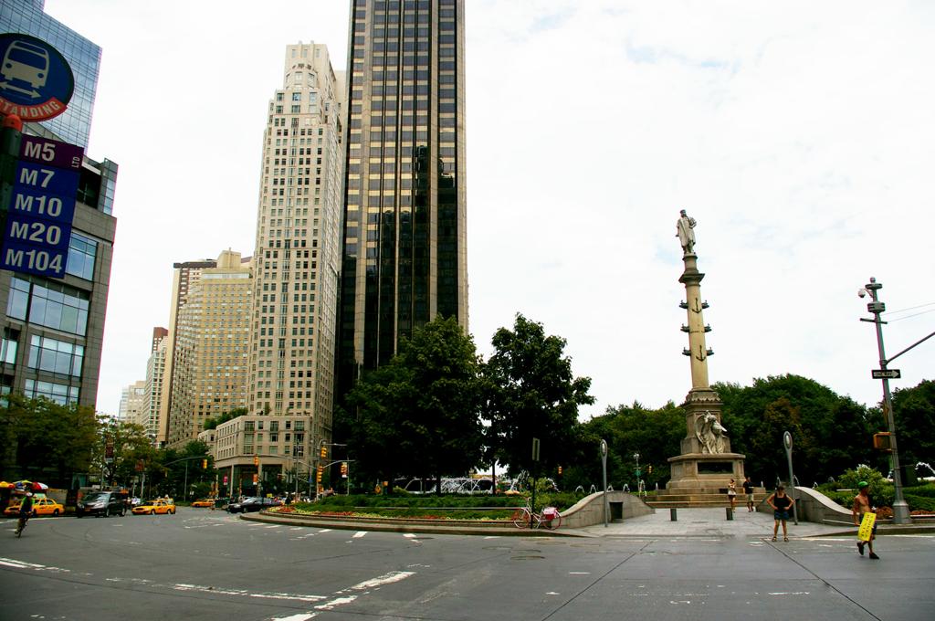 a view of a city street with tall buildings