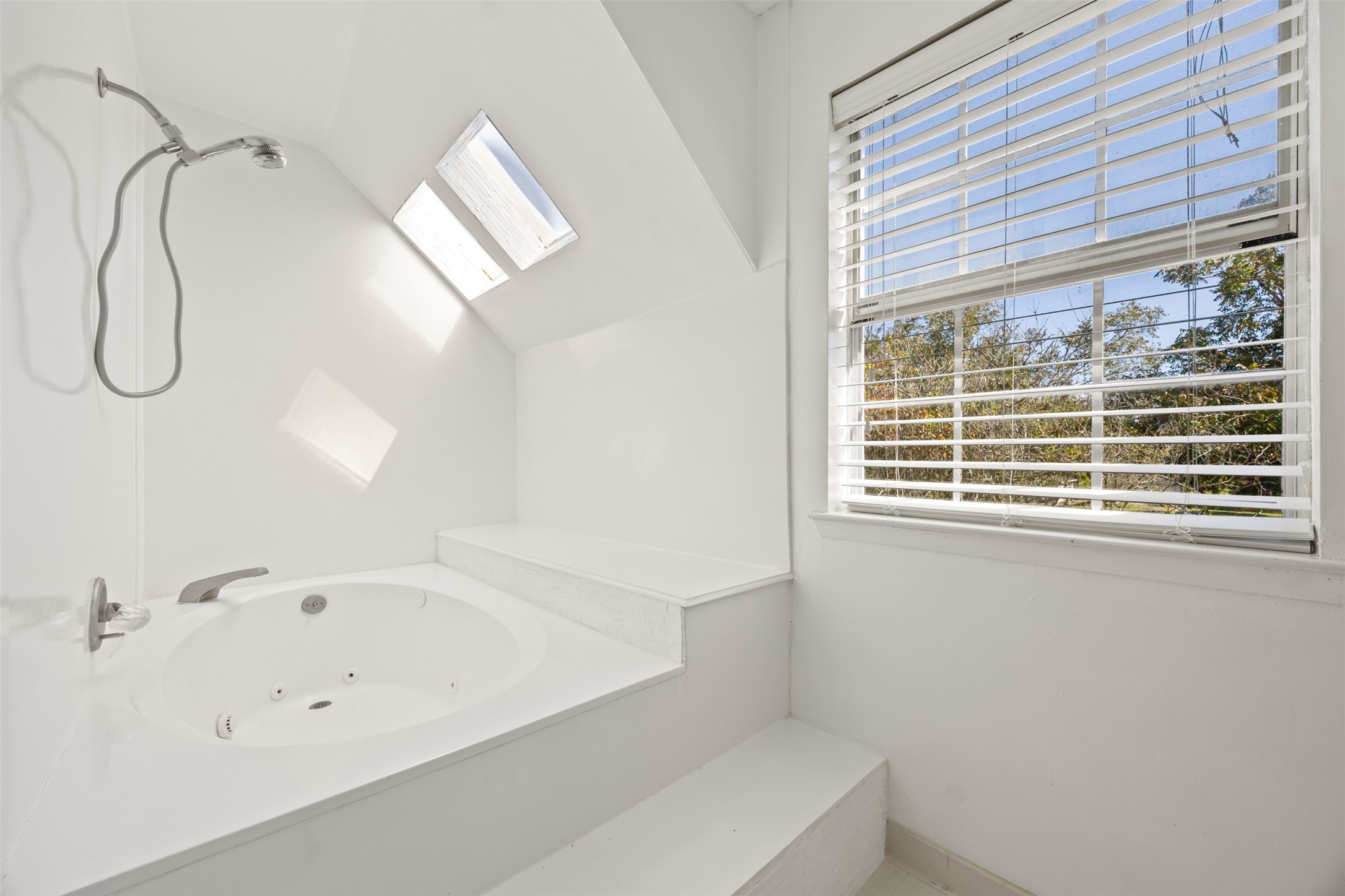 4910 Cark Street Santa Fe, TX 77517 - Photo 20 of 31 a bathroom with a bathtub and window