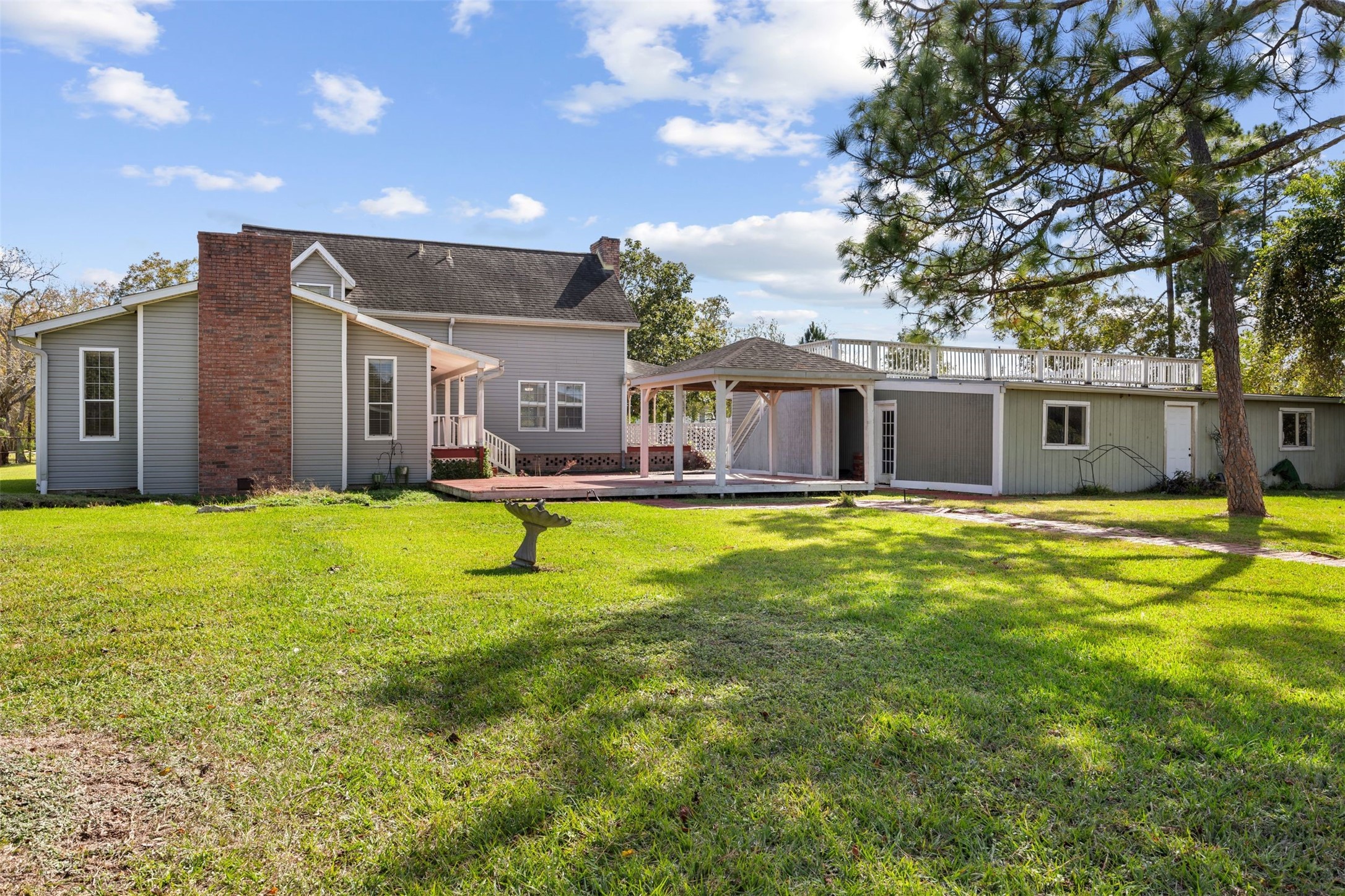 4910 Cark Street Santa Fe, TX 77517 - Photo 27 of 31 a swimming pool with outdoor seating and yard